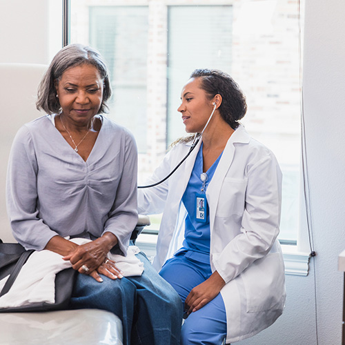 Doctor performing surgery with a team
